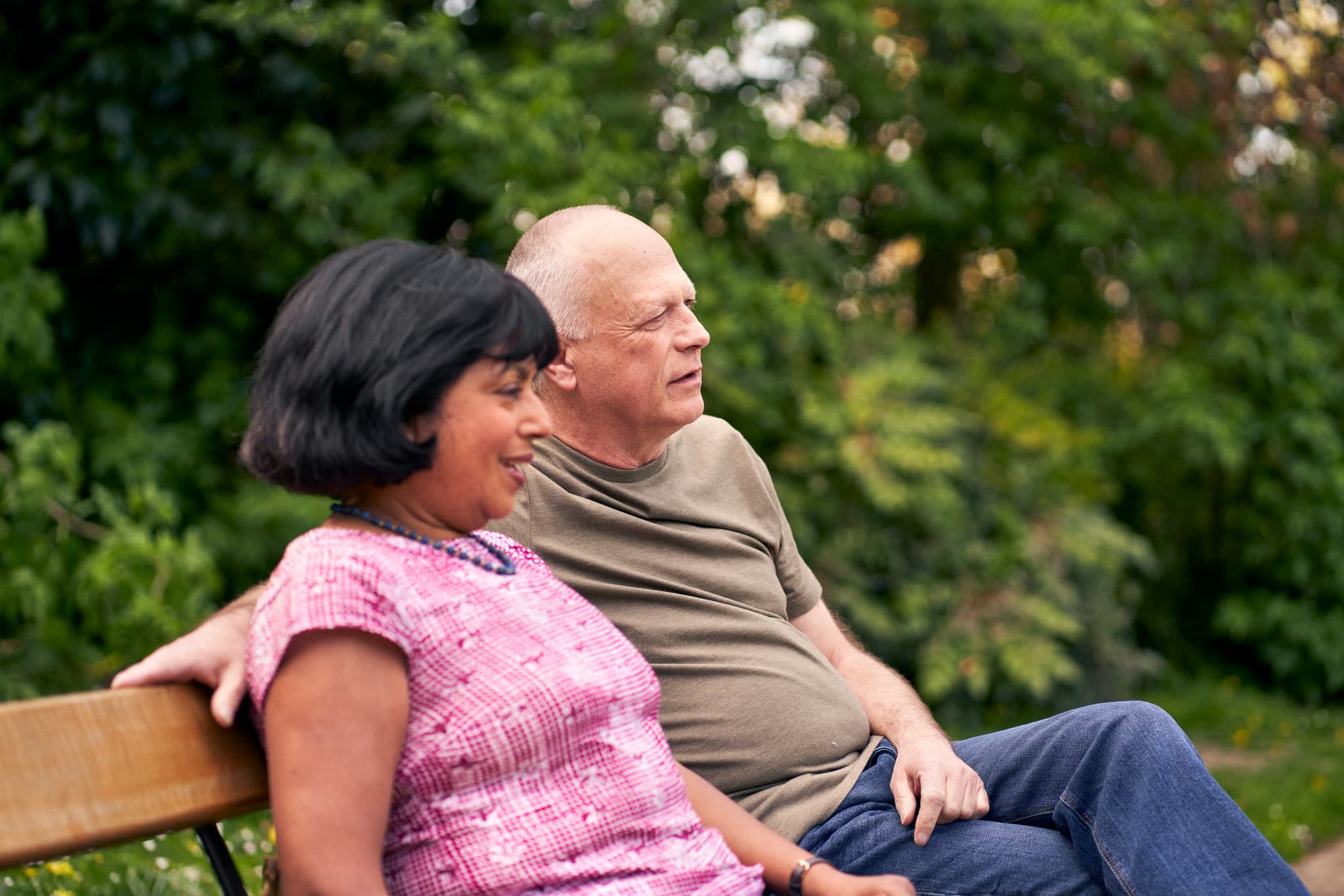 Image of a couple on a park bench.