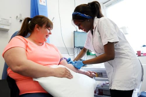 Photograph of a patient having a blood test.