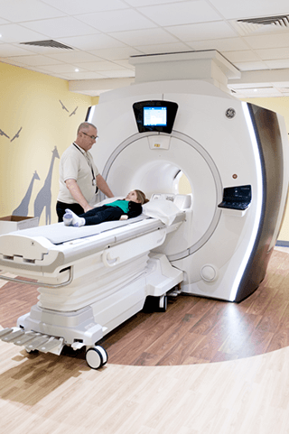 Photograph of a child having an MRI scan.