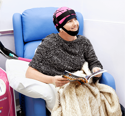Photograph of woman with cold cap.